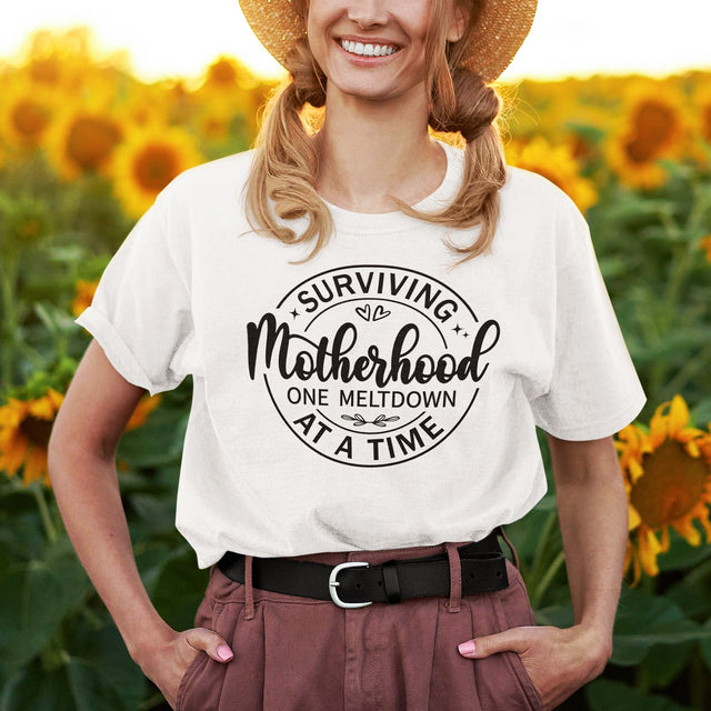 surviving-motherhood-one-meltdown-at-a-time-mom-tee-parents-t-shirt-mom-tee-motherhood-t-shirt-parenting-tee#color_white