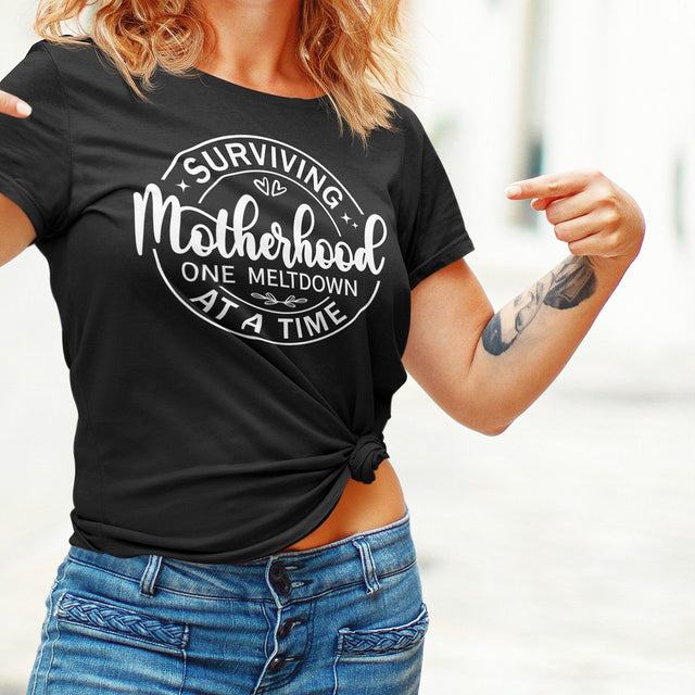 surviving-motherhood-one-meltdown-at-a-time-mom-tee-parents-t-shirt-mom-tee-motherhood-t-shirt-parenting-tee#color_black