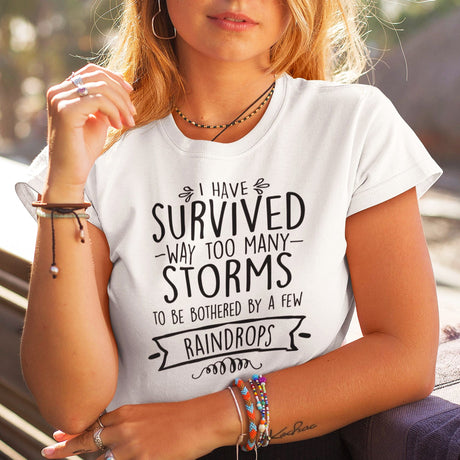 i-have-survived-way-too-many-storms-to-be-bothered-by-a-few-raindrops-life-tee-survived-t-shirt-resilience-tee-storms-t-shirt-life-tee#color_white