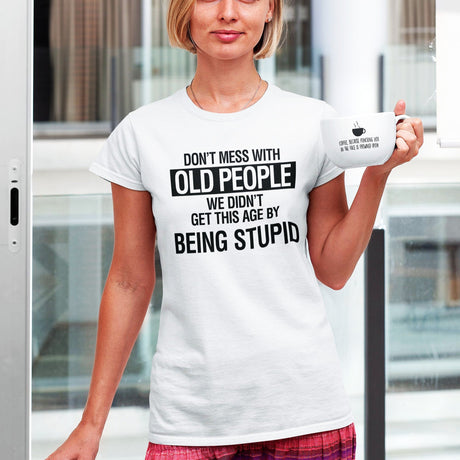 dont-mess-with-old-people-we-didnt-get-this-age-by-being-stupid-life-tee-wisdom-t-shirt-experience-tee-age-t-shirt-resilience-tee#color_white