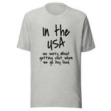 in-the-usa-we-think-about-getting-shot-when-we-go-buy-food-usa-tee-government-t-shirt-shot-tee-t-shirt-tee#color_athletic-heather