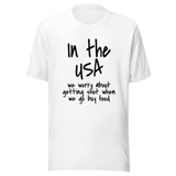 in-the-usa-we-think-about-getting-shot-when-we-go-buy-food-usa-tee-government-t-shirt-shot-tee-t-shirt-tee#color_white