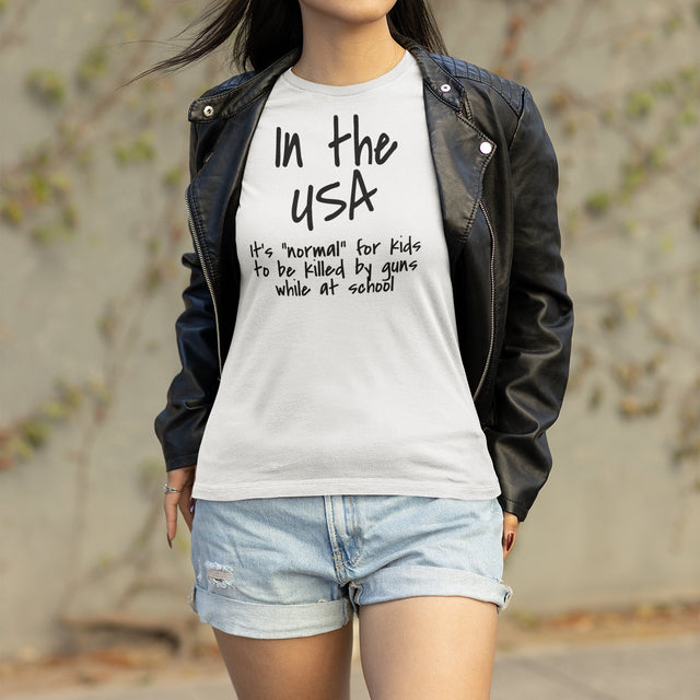 in-the-usa-its-normal-for-kids-to-be-killed-by-guns-while-at-school-usa-tee-normal-t-shirt-guns-tee-t-shirt-tee#color_white