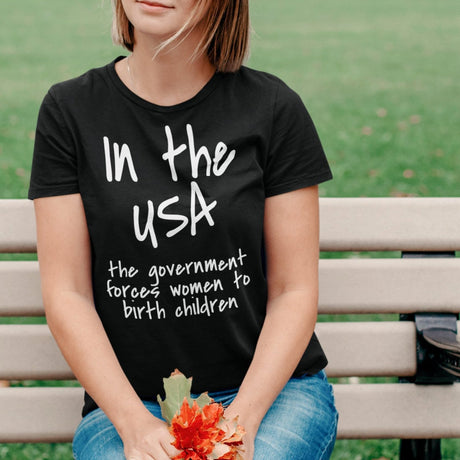 in-the-usa-the-government-forces-women-to-birth-children-usa-tee-government-t-shirt-forces-tee-t-shirt-tee#color_black